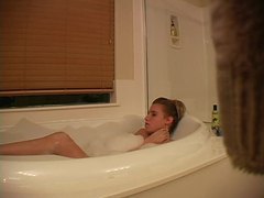 TubeChubby presents: Hidden camera captures girl masturbating in bathtub